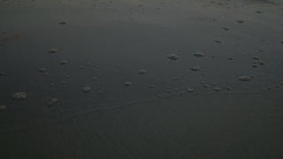 Romantic twilight beach water stock footage