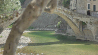 Medieval bridge Dolceacqua Italy stock footage