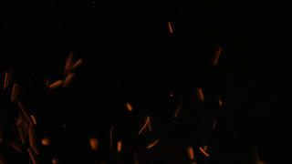 Fire sparks flying embers background