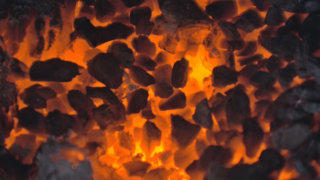 Glowing burning coal stock footage